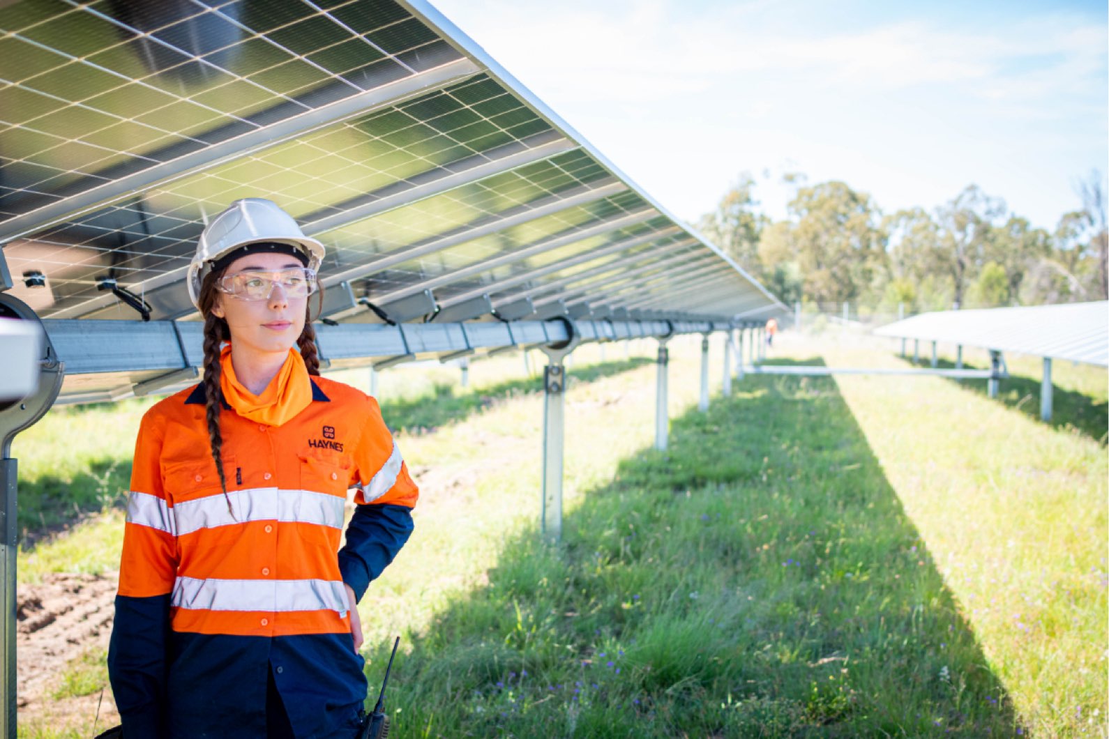 Solar farm female worker standing in the shade