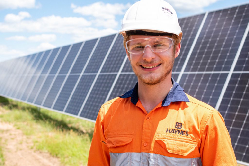 Male worker on a solar farm