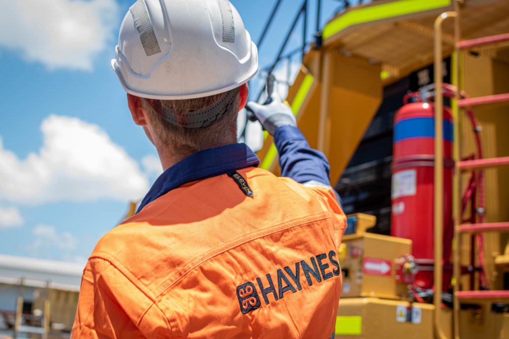 Haynes_Mining_Miners pointing in front of truck2